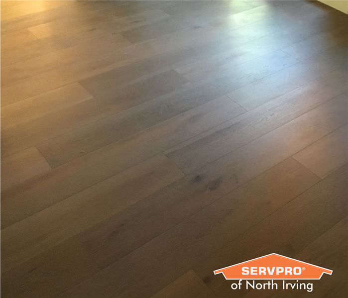 brown hardwood floor reconstruction after water damage
