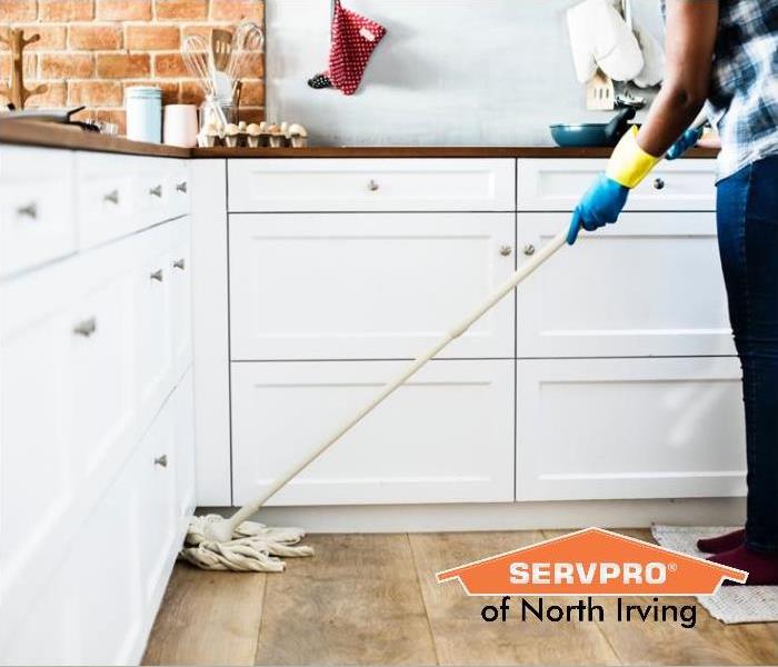 cleaning kitchen floors with mop