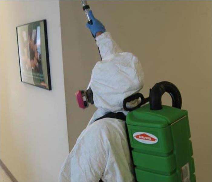 Dallas Mold Remediation Service In Building wearing hazmat suit
