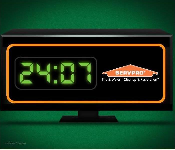 black clock with the text 24:07 and the SERVPRO logo